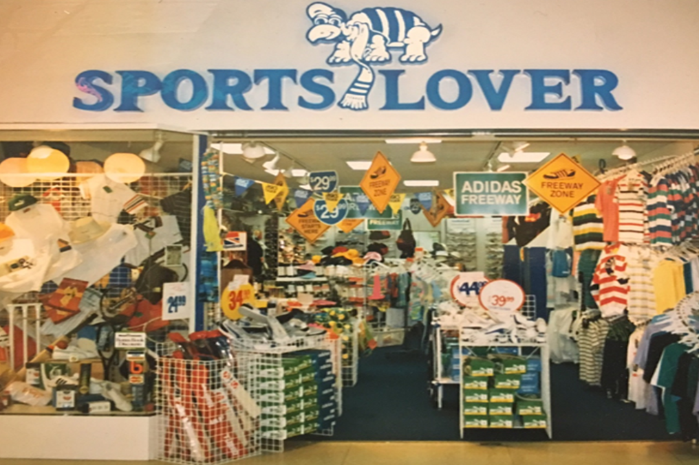 Storefront of 'Sports Lover' with various sports-themed merchandise.